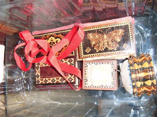 Four Tunbridge ware needle books, a stickware pin cushion, a stamp box and a ribbon bookmark